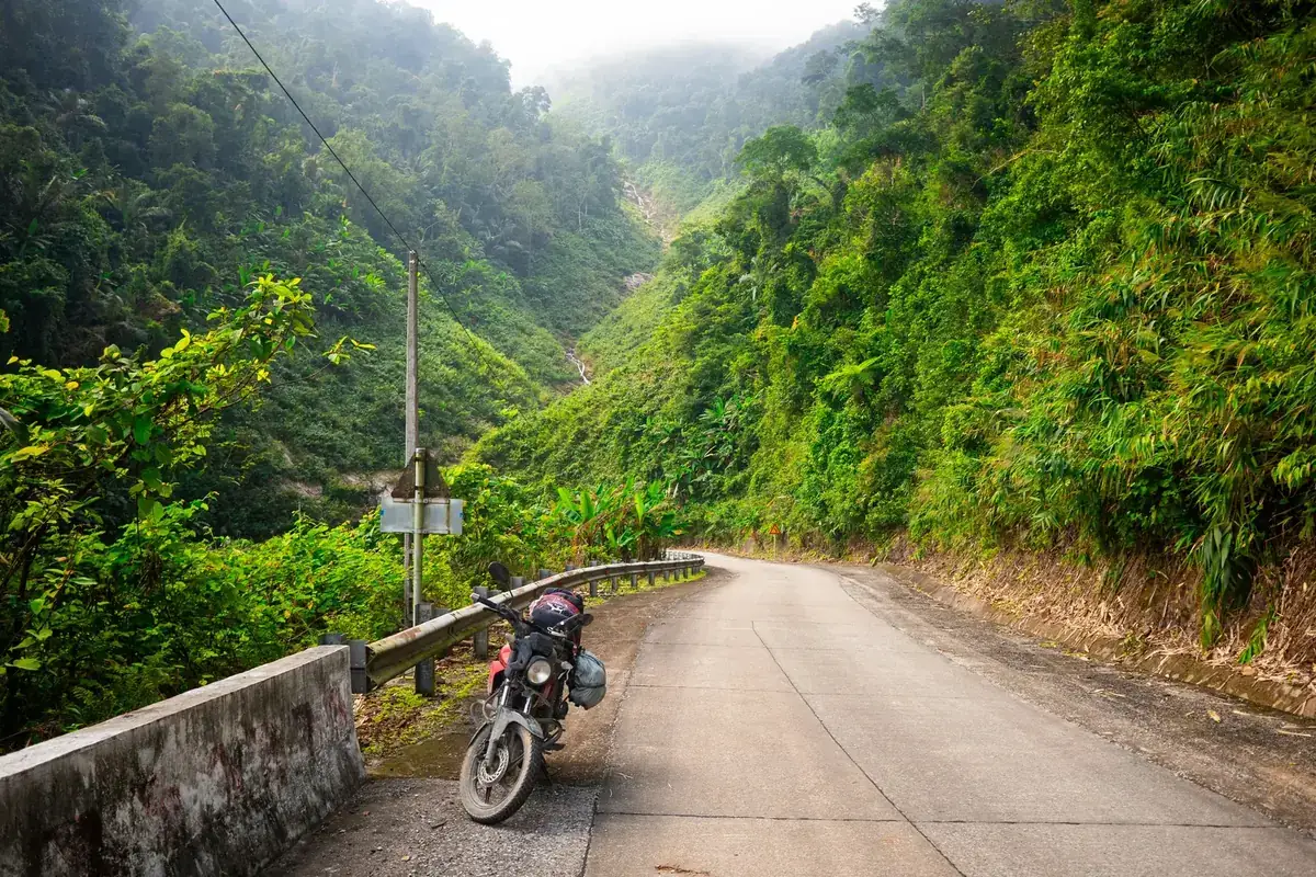 Motorbike on a mountain road through Vietnamese jungle