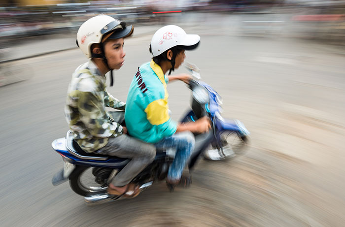 bigstock-Two-Men-On-Bike-In-Hoi-An-Vie-65189665_web